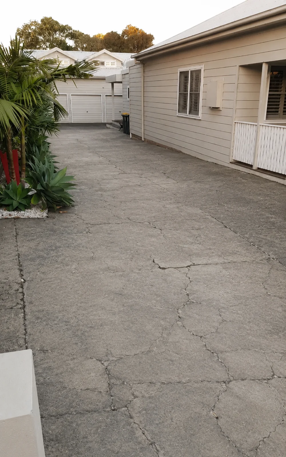 Cracked concrete driveway in Adelaide before resin-bound resurfacing