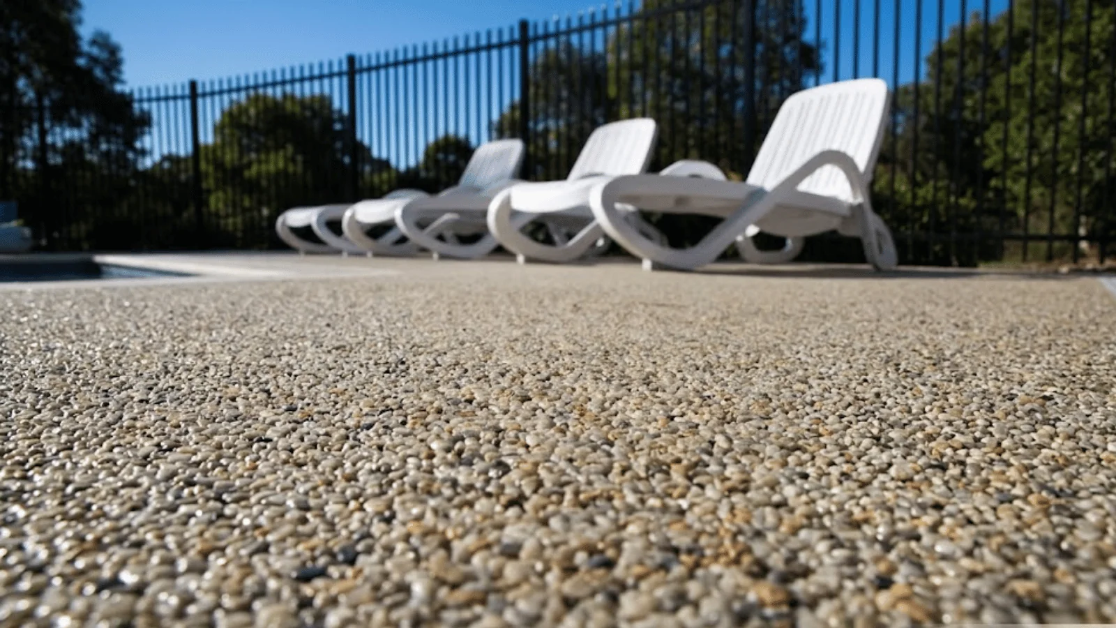 Resin-bound outdoor area transition between patio and pool