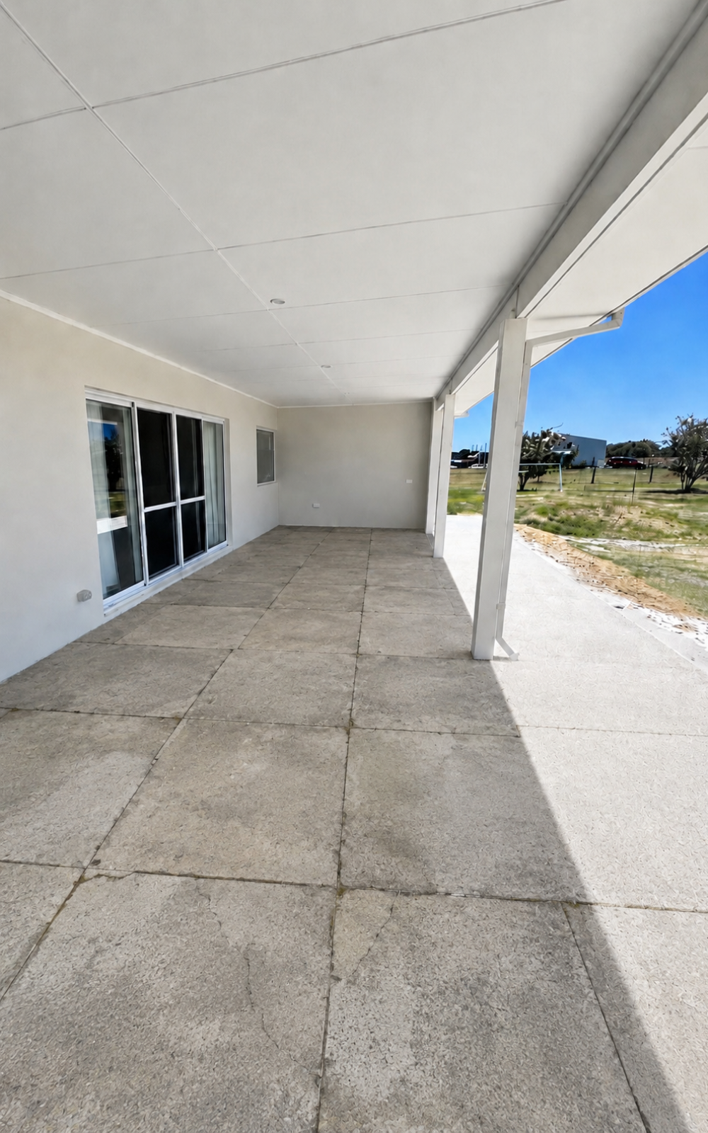 Tired patio surface before Gorilla Surfaces resurfacing